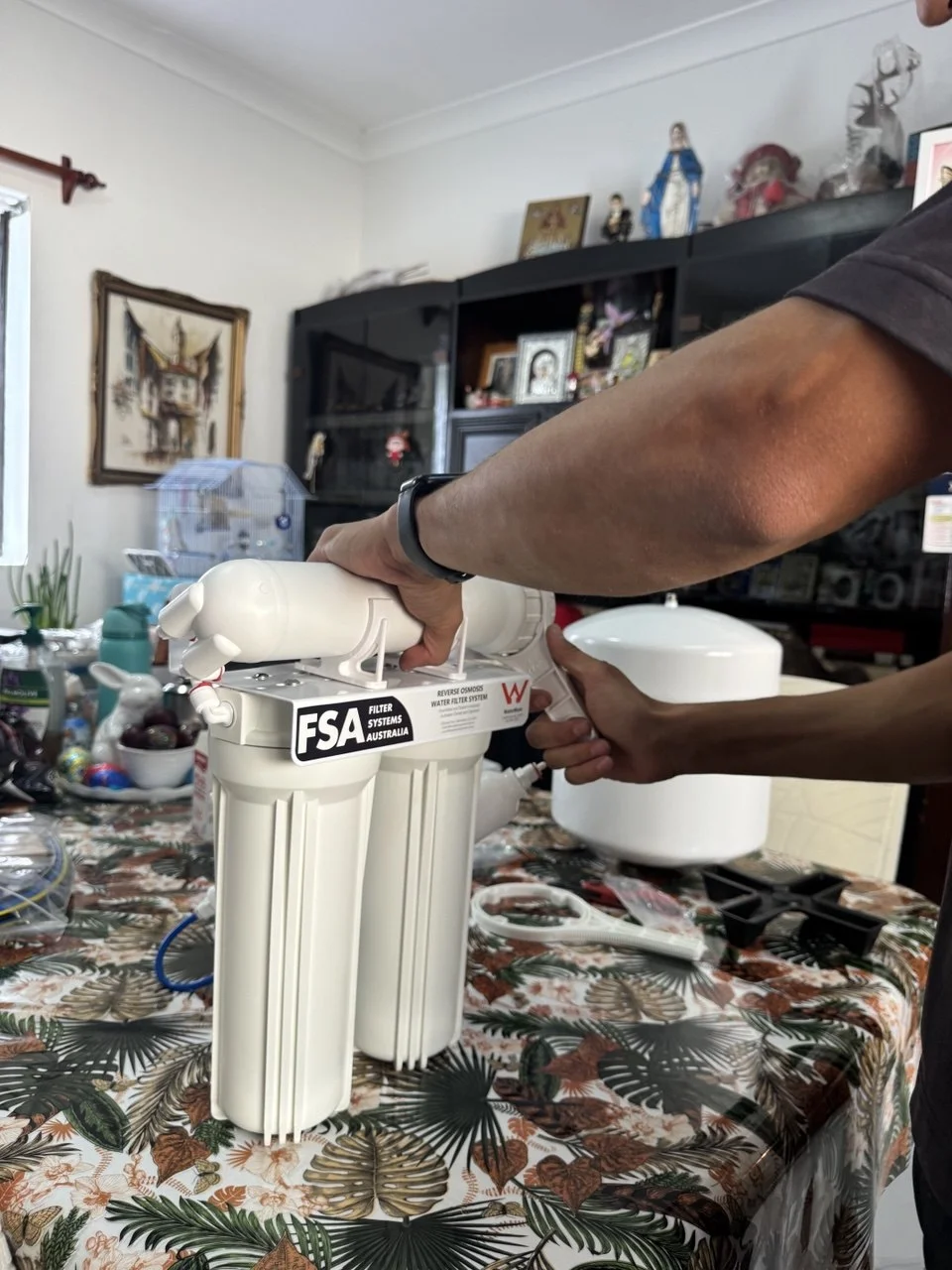 Jean-Paul Barbar installing water filter system at Sydney home