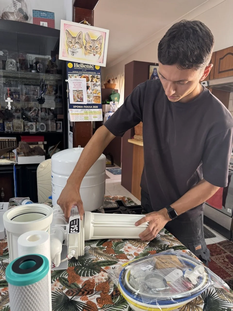 Licensed plumber Jean-Paul Barbar at work installing water filter Sydney
