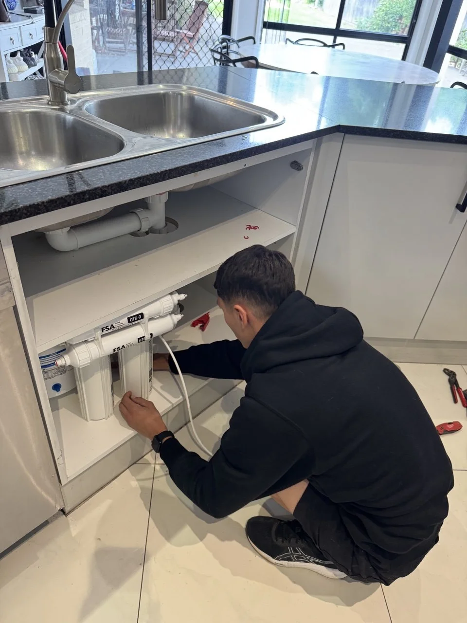 4-stage RO system installed and connected under Sydney kitchen sink