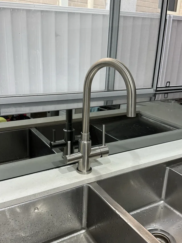 Three way mixer over a double sink