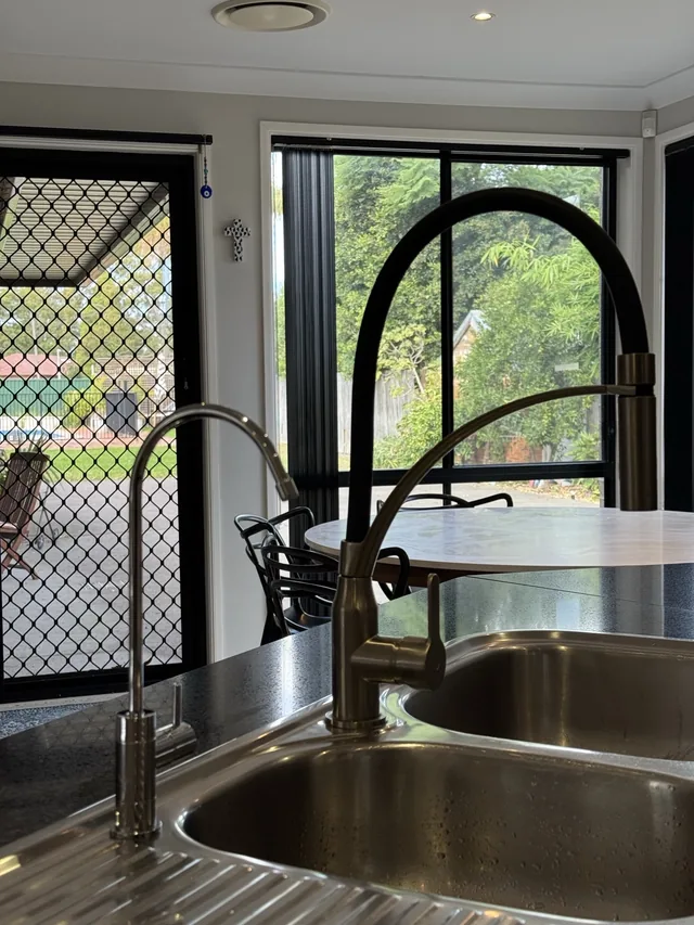 A filter tap beside a black mixer