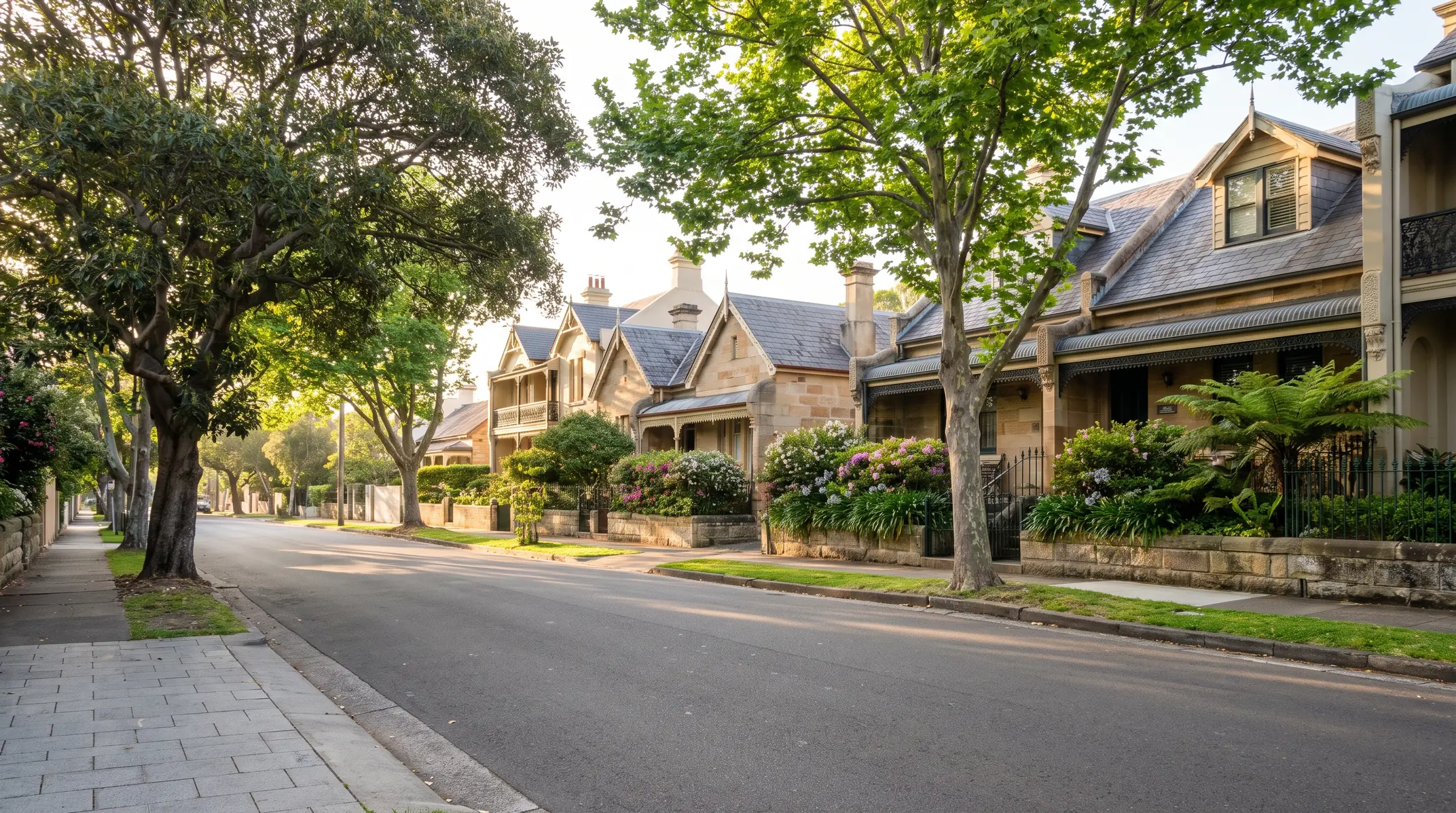 Sandstone homes and Victorian terraces along a leafy Randwick residential street, illustrative residential scene
