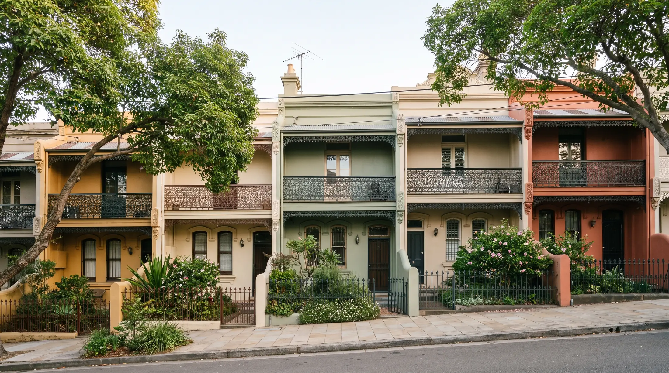 Painted Victorian terraces and leafy gardens on a Surry Hills side street, illustrative residential scene