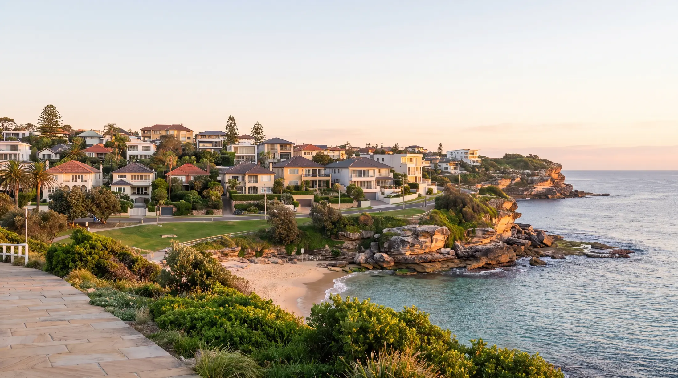 Coastal homes above Tamarama’s small beach and adjoining parkland, illustrative residential scene