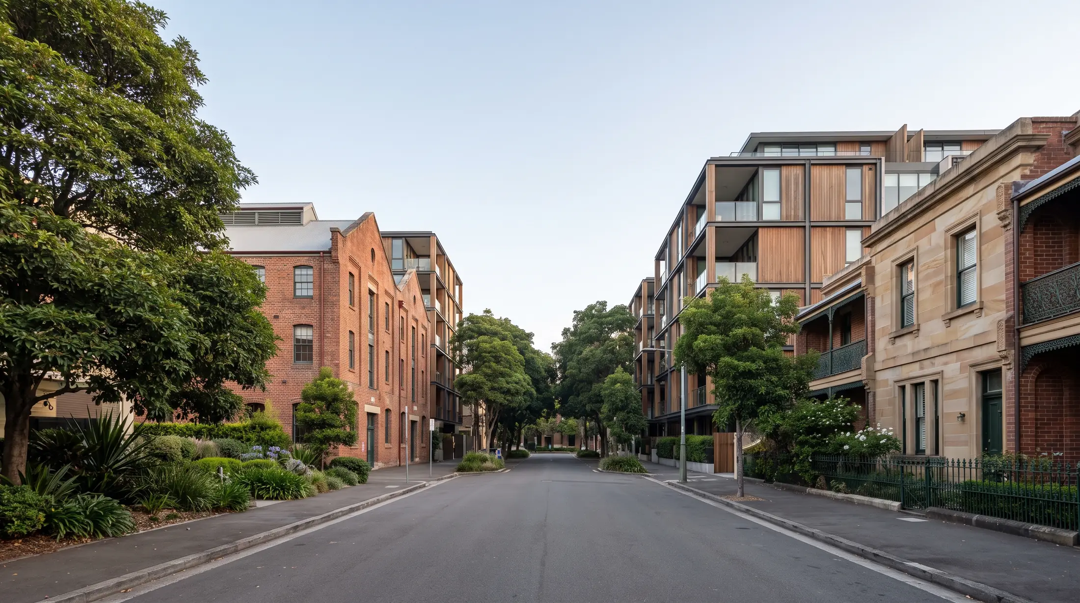 Brick apartment buildings and Victorian terraces along an Ultimo street, illustrative residential scene
