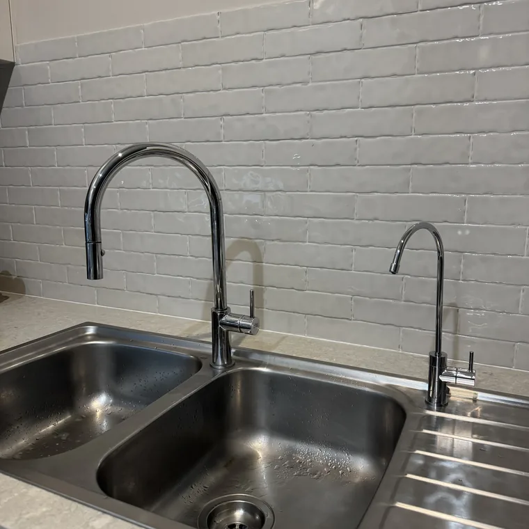A gooseneck filter tap in gunmetal