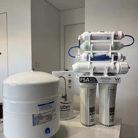 A full reverse osmosis kit with tank ready to install in a Sydney kitchen