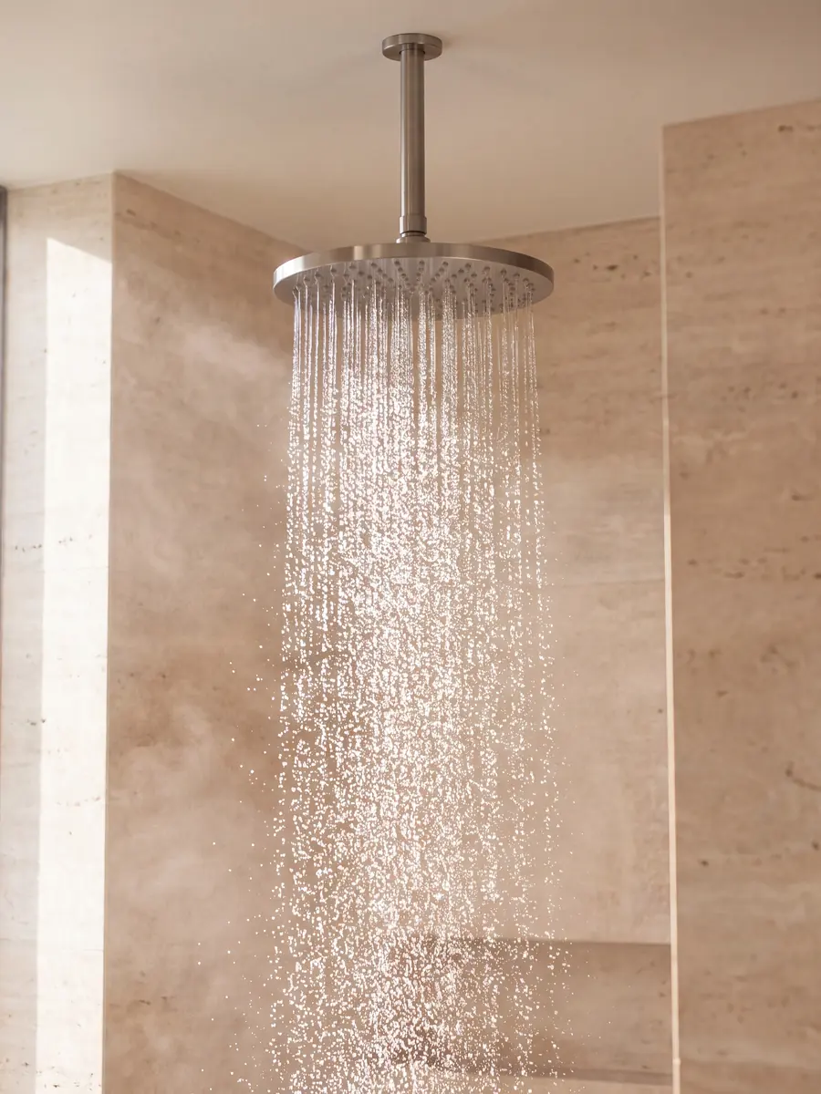 A rain shower running in a stone bathroom